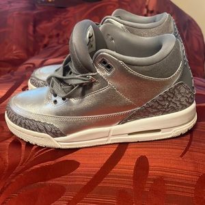 Silver Youth Air Jordans Size 7.  Fits a Women’s size 8